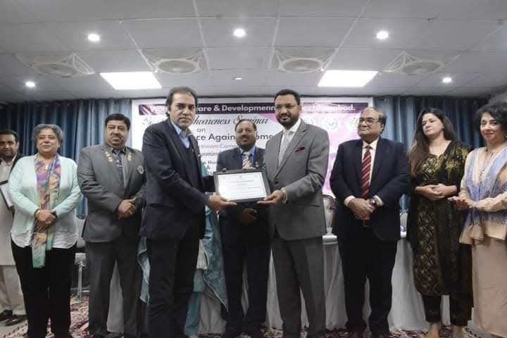Haseeb Kiyani Receiving award from the Minister of Human Rights on his contributions in HR